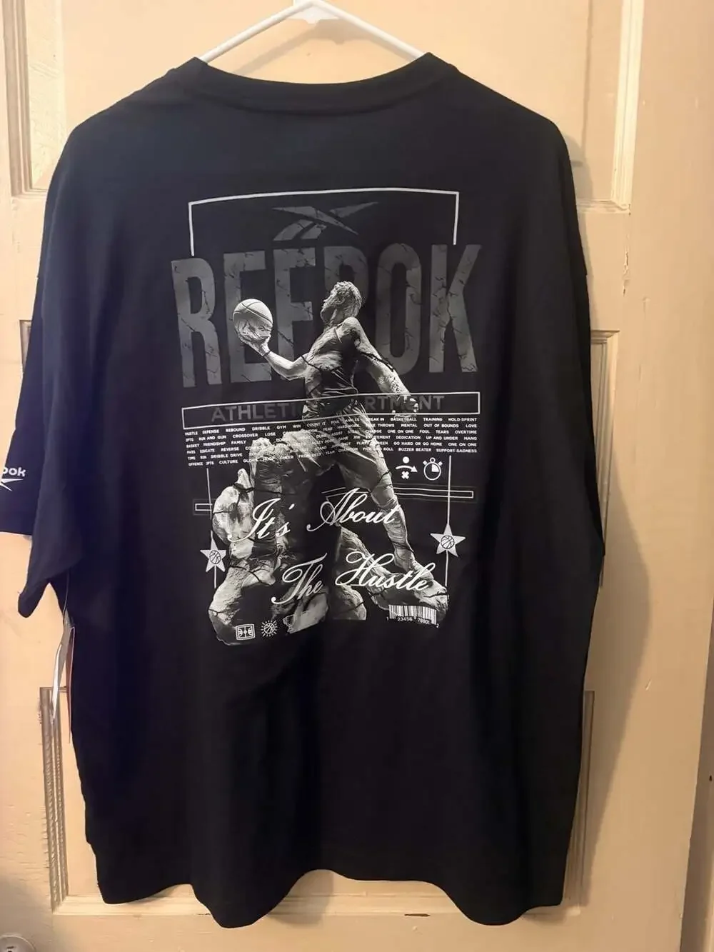 Reebok Men's Basketball Graphic 'It's About The Hustle' Short Sleeve T-Shirt